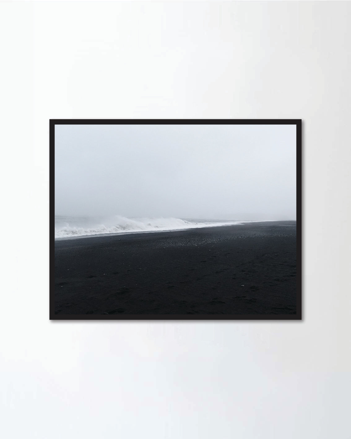 The waves hitting the beach at Black Sand Beach