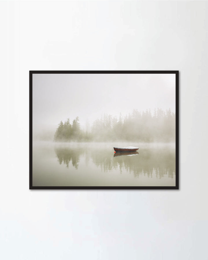 Boat on the lake at morning fog.