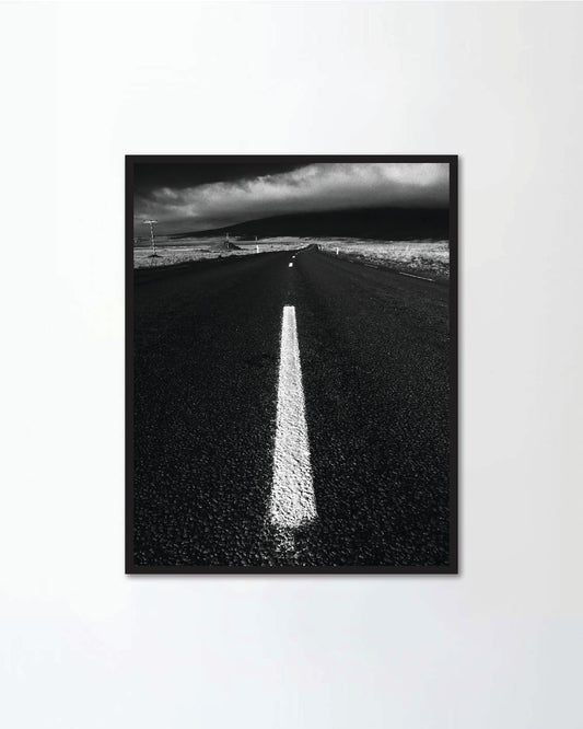Low angle view of empty road winding