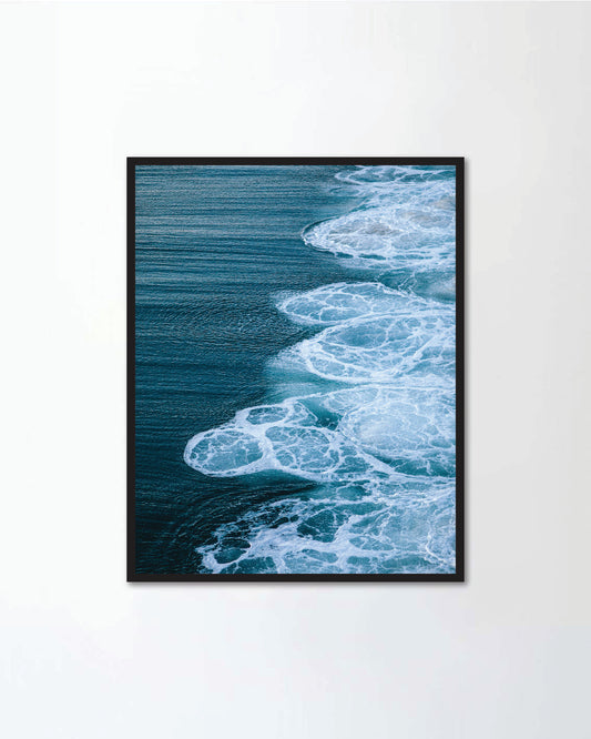 a blue colour sea water with wave and white