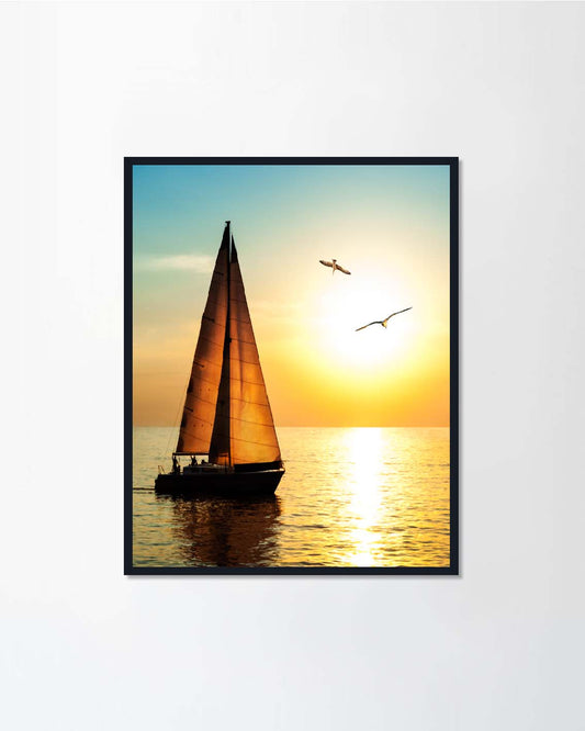 Yacht sailing against sunset