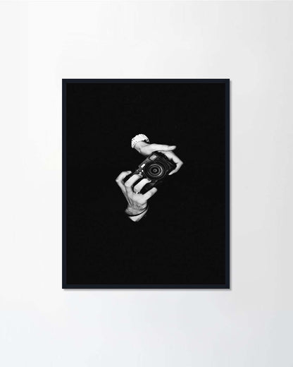 A man photographer holding a camera
