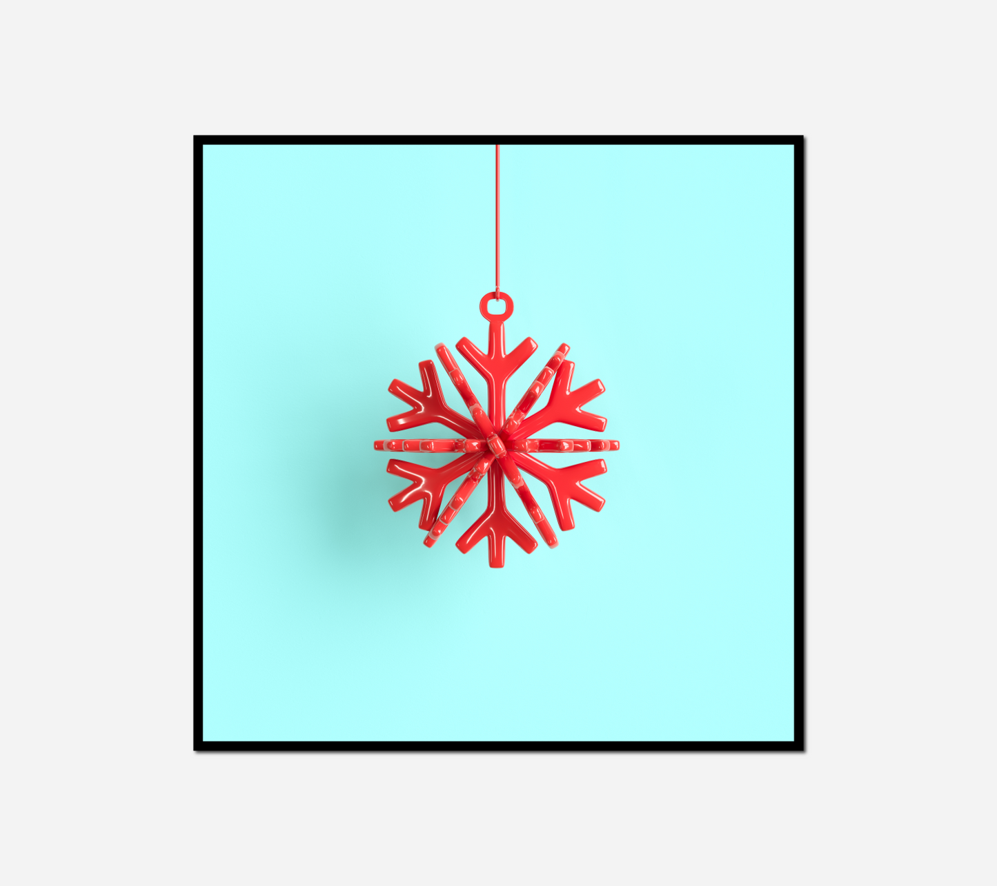 red snowflake hanging from red string