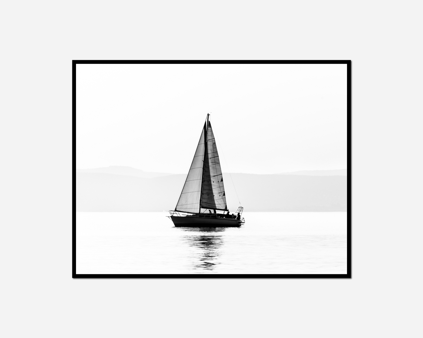 sailboat ocean mountain