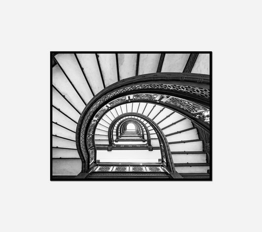 black white spiral staircase clock