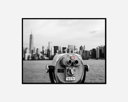 Close coin operated telescope overlooking city