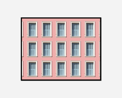 Pink building many windows clock