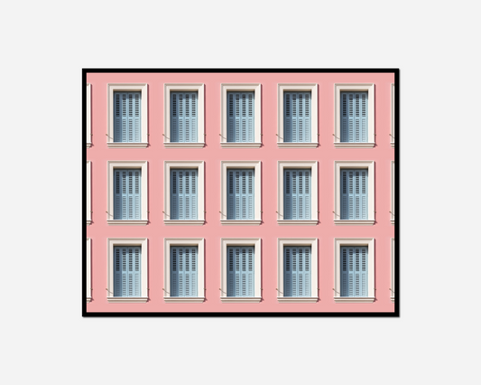 pink building many windows clock