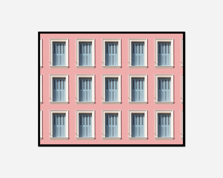pink building many windows clock