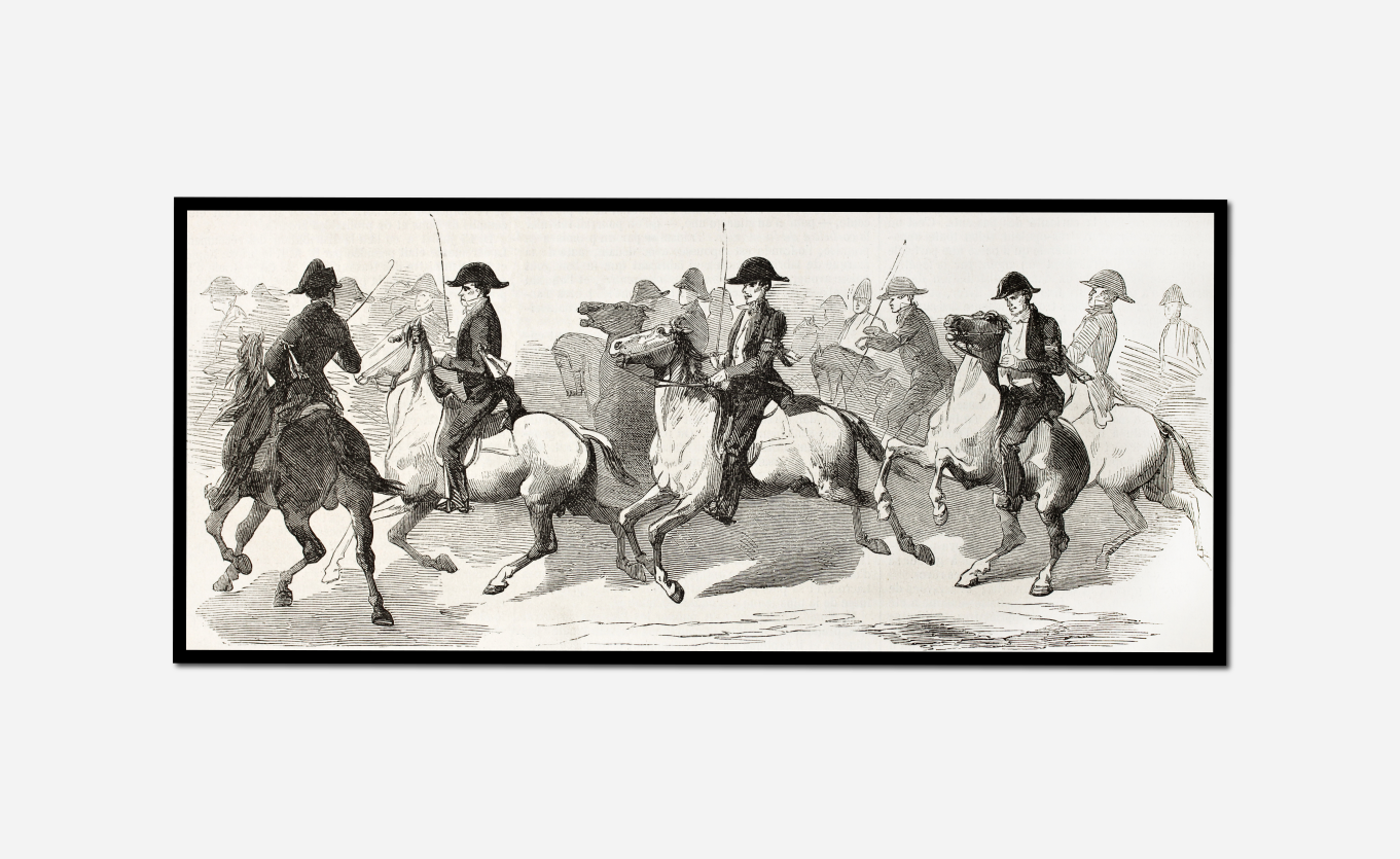 four men riding horses line beach